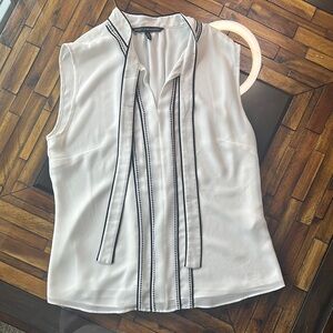 White Sleeveless Blouse with Black Trim